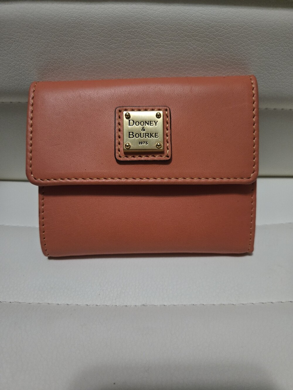 Dooney & Bourke Coral Pink Leather Compact Tri-fold Wallet with Gold Plaque.NWOT